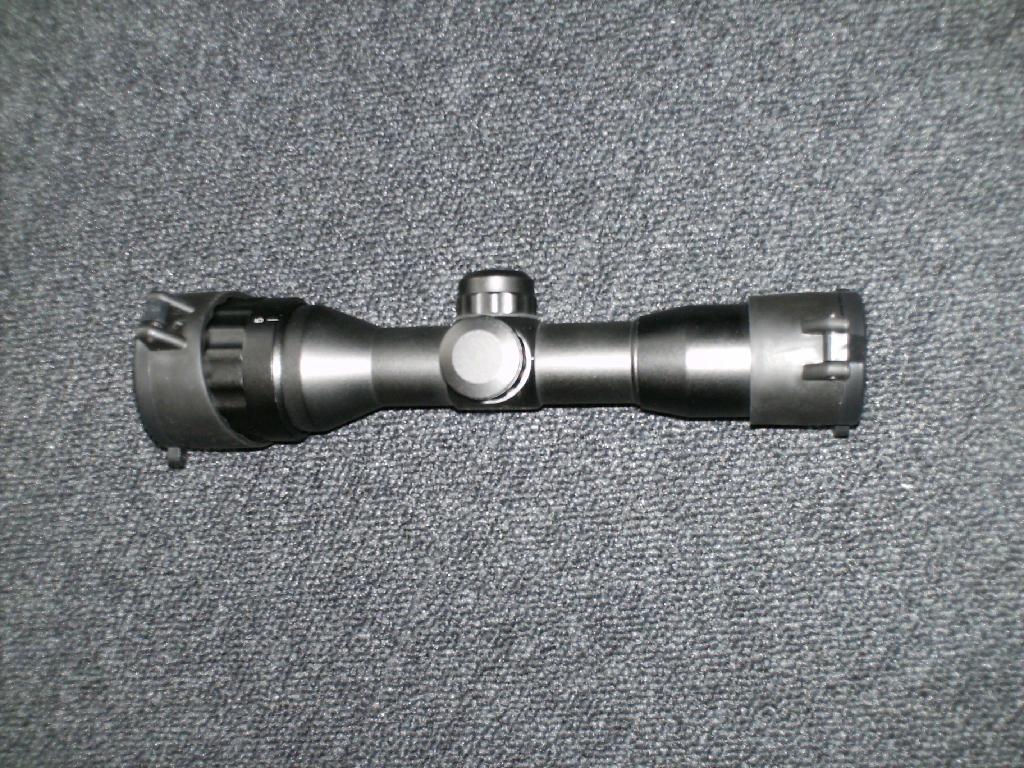 Kính ngắm để lắp vào vũ khí; kính tiềm vọng; kính viễn vọng được thiết kế là bộ phận của máy, thiết bị, dụng cụ hoặc bộ dụng cụ của Chương này hoặc 10VI